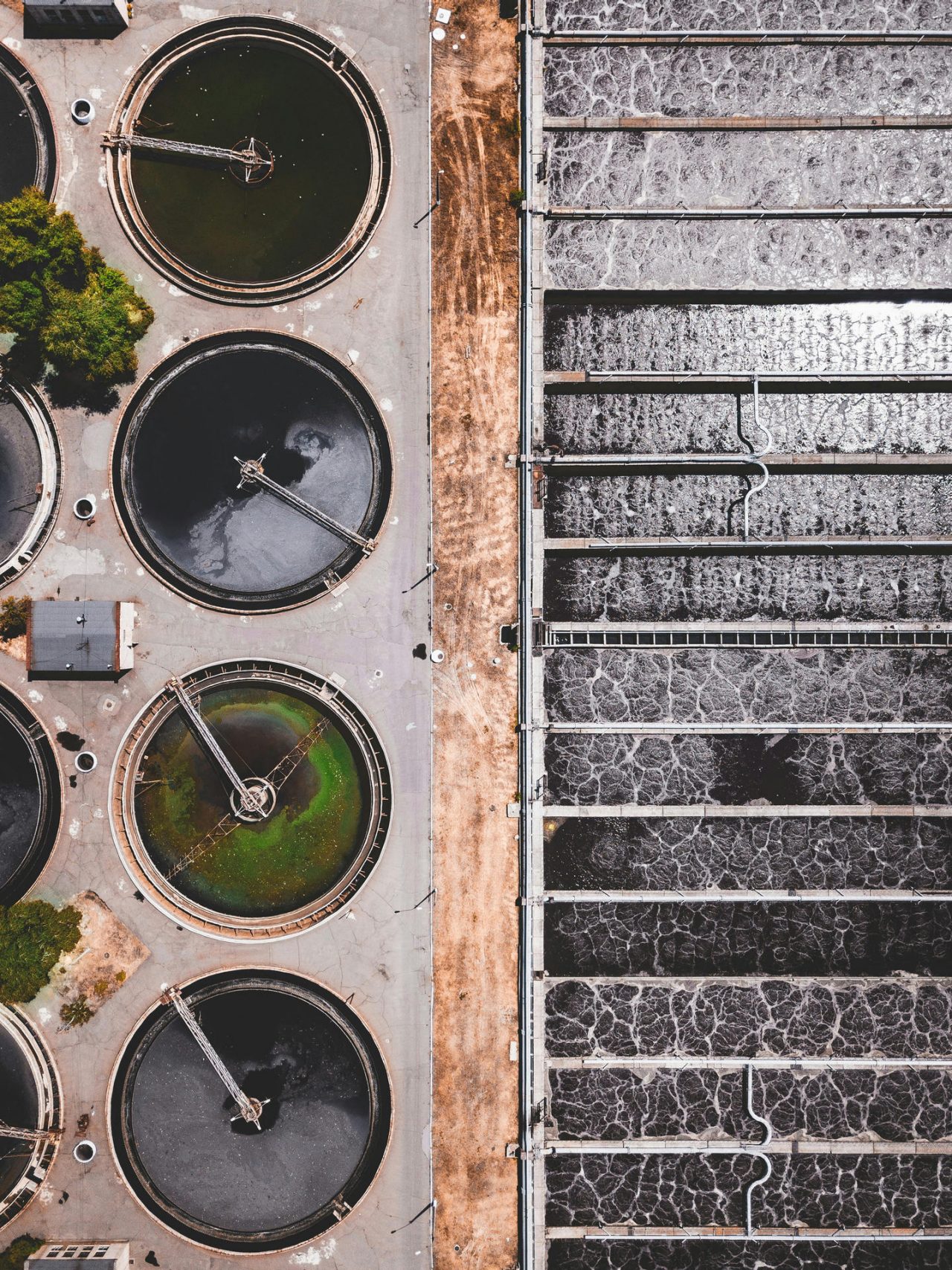 Top-down view of an industrial water treatment facility with multiple filtration pools. 