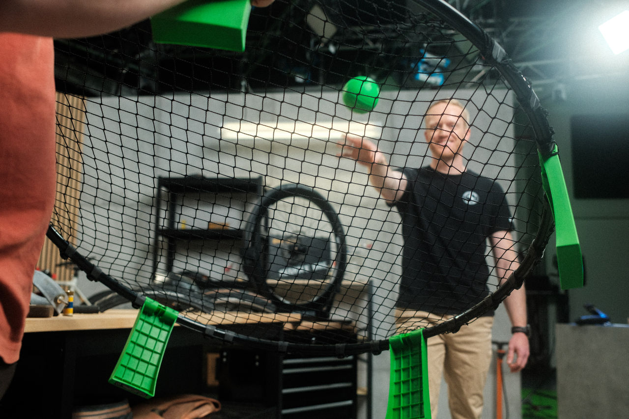 Oliver throwing a ball into a net