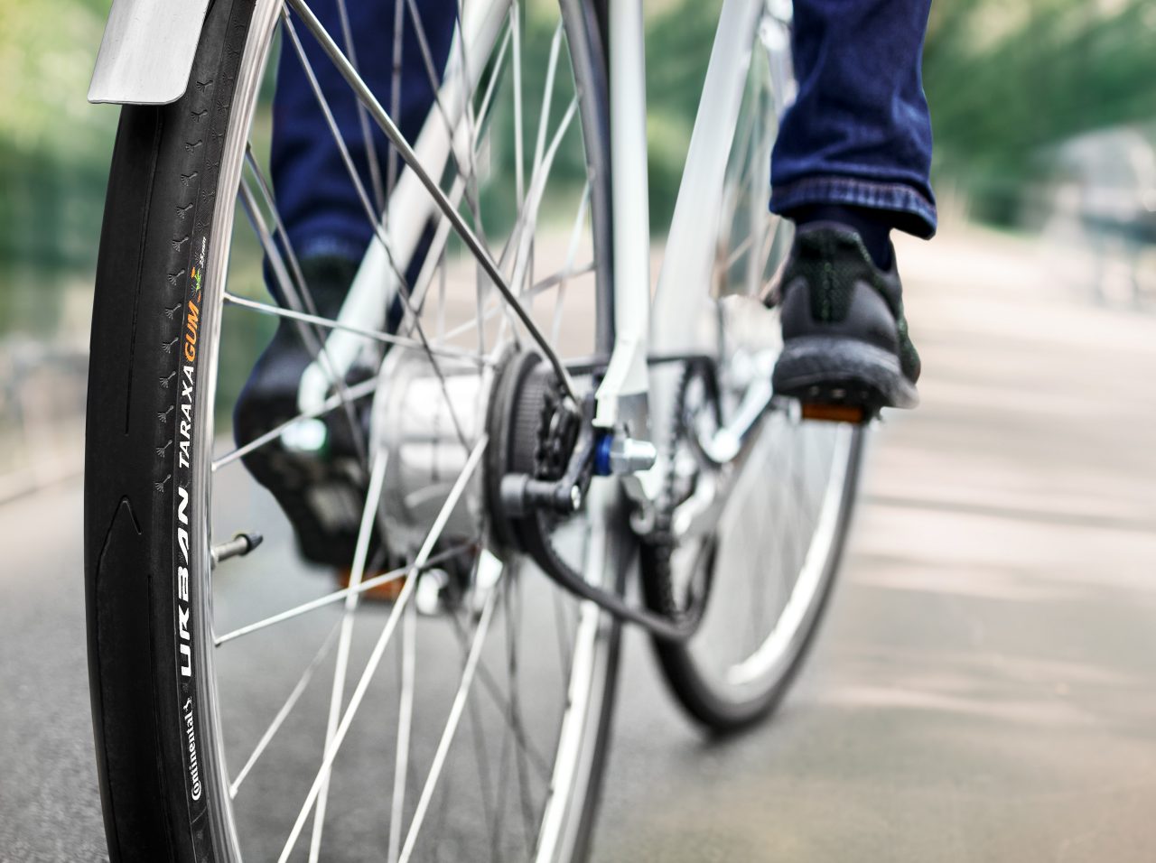 A person riding a bike with Taraxagum tires