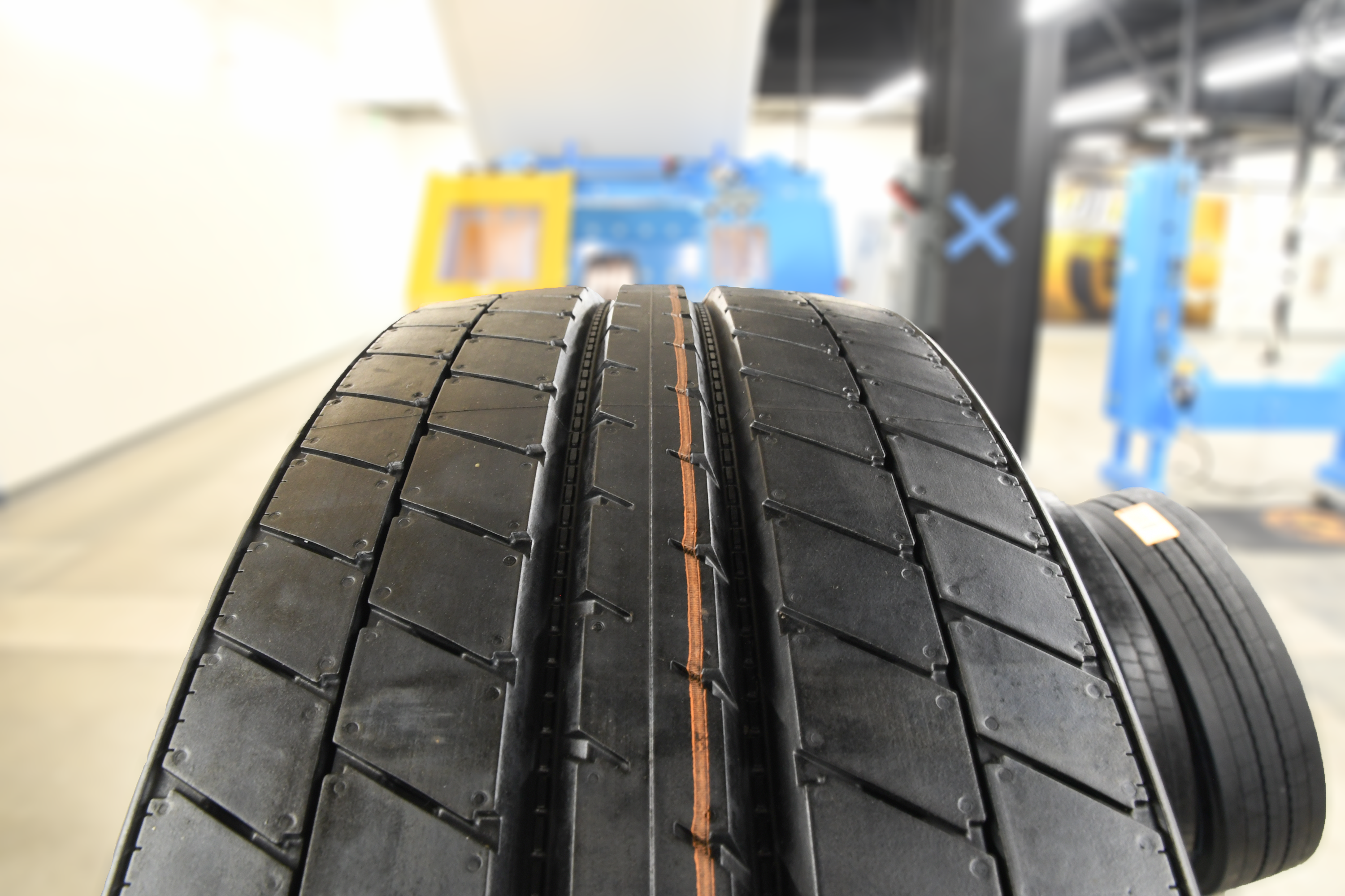 A close-up image of a retreaded tire awaiting final inspection involving high-pressurized testing for safety and reliability.