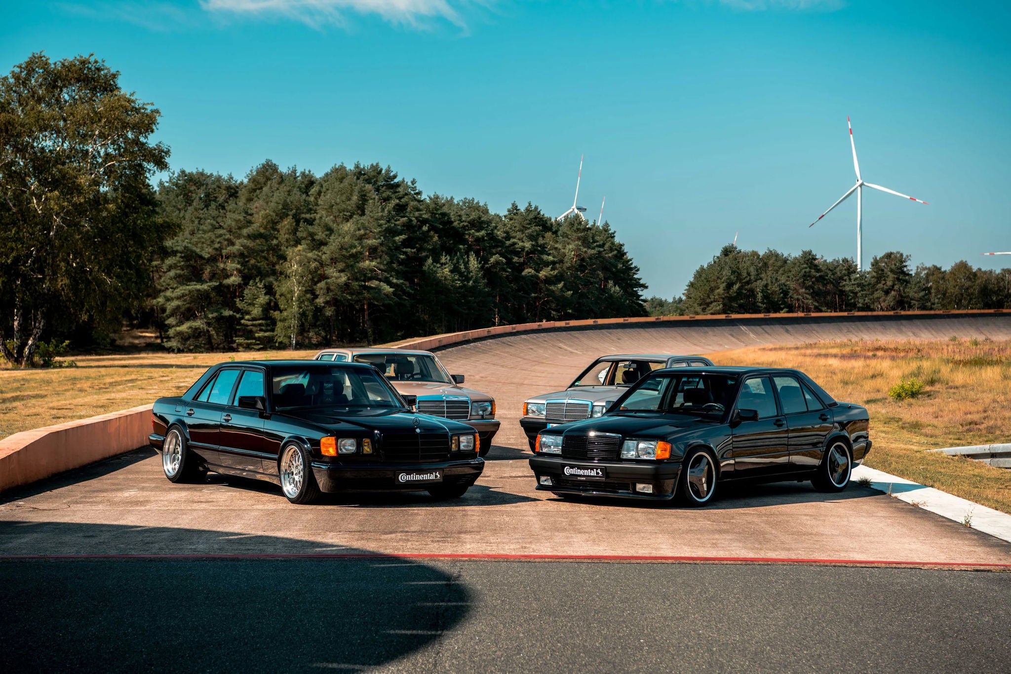 A group of cars parked on a track