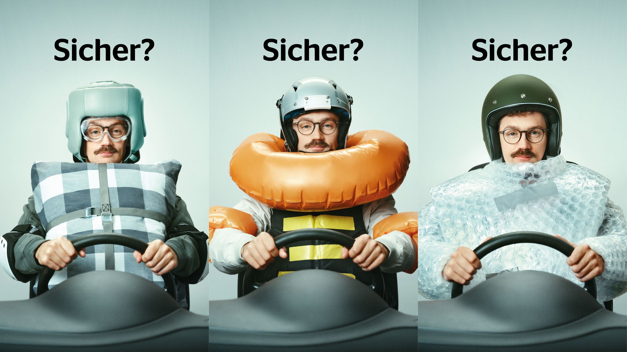Mann mit verschiedenen umgebundenen Sicherheitsmassnahmen (Kissen, Luftpolsterfolie, Schwimmring) hinter dem Autosteuer. Überschrift: Sicher?