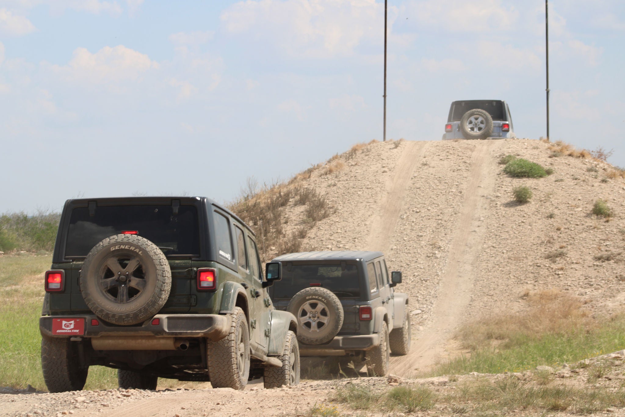Jeeps on General Tires conquering the rugged hill at UPG pushing traction and durability to the limit. 
