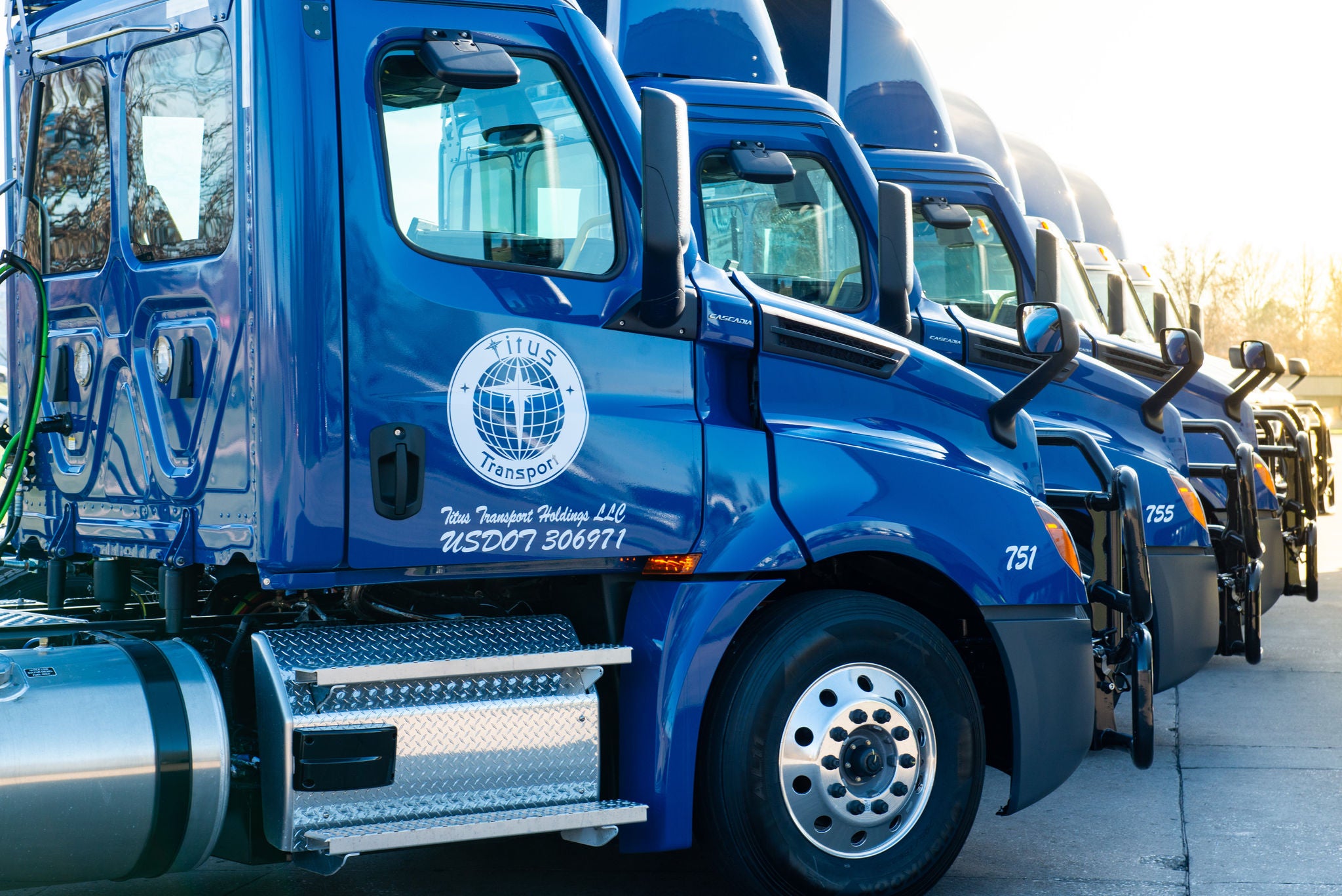 Titus Transport fleet parked in the truck yard.