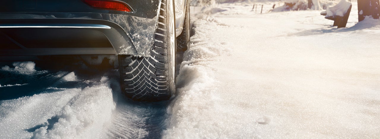 Car with winter tires on snow.