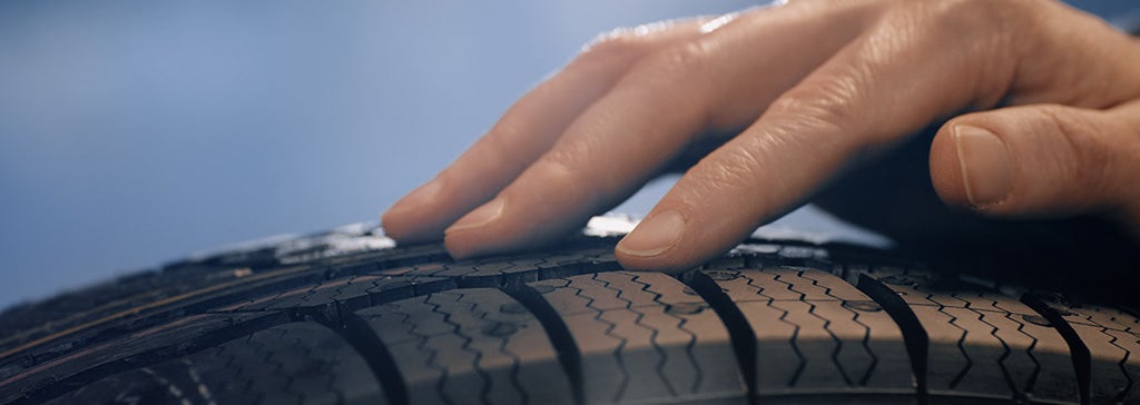 Hand on a tire.