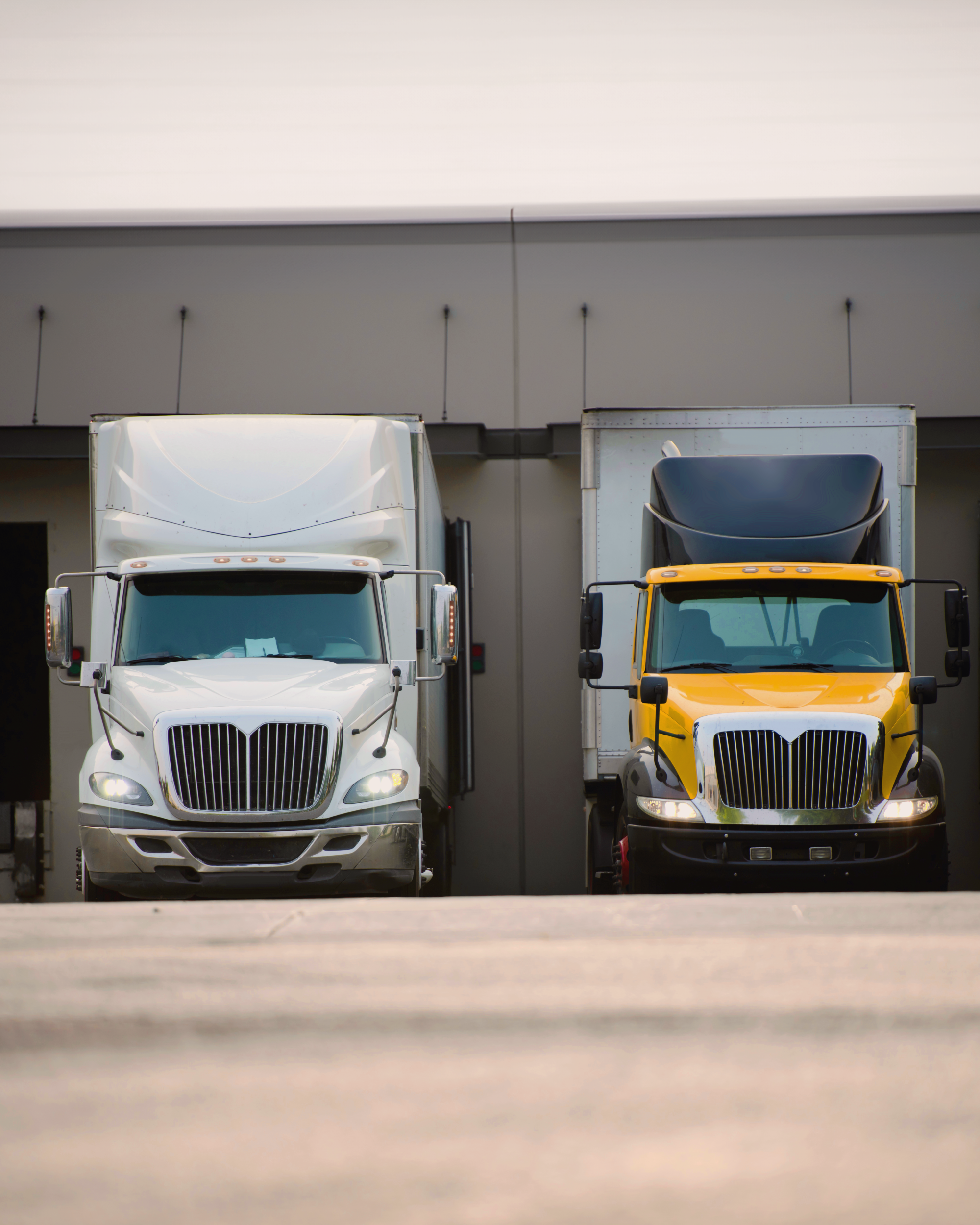 Regional trucks picking up their loads from a distribution center