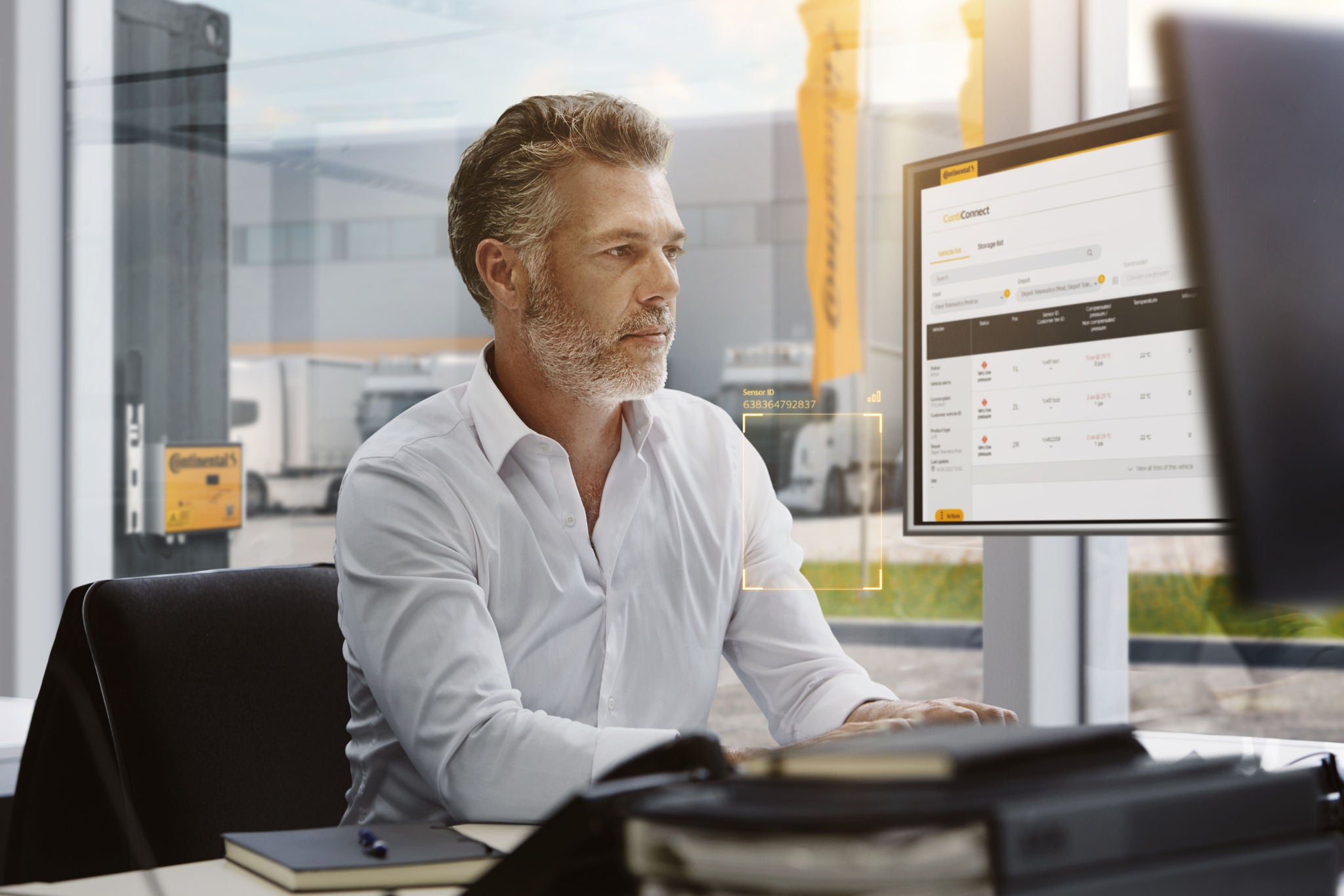 Employee sitting infront of his Computer