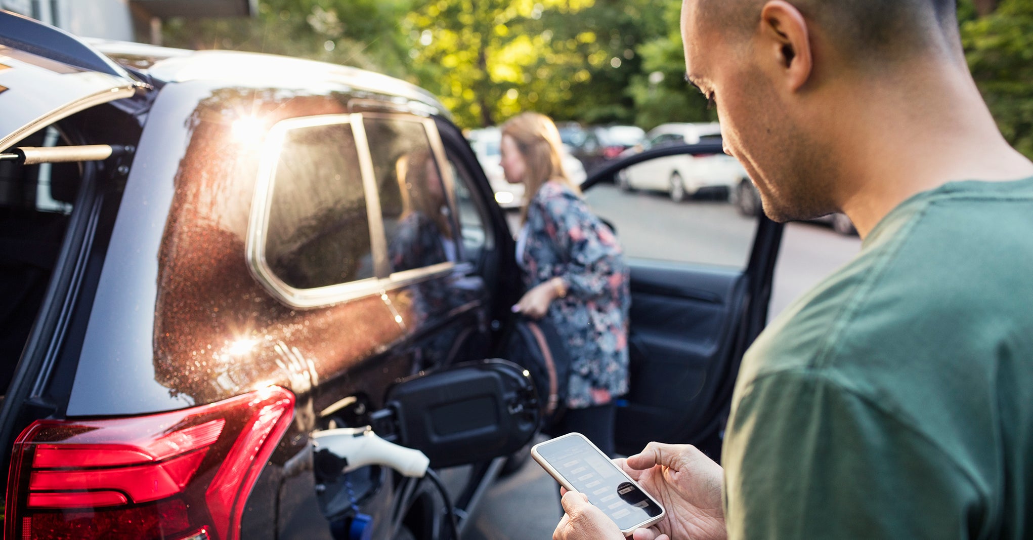 Loading an electric car with smartphone app.