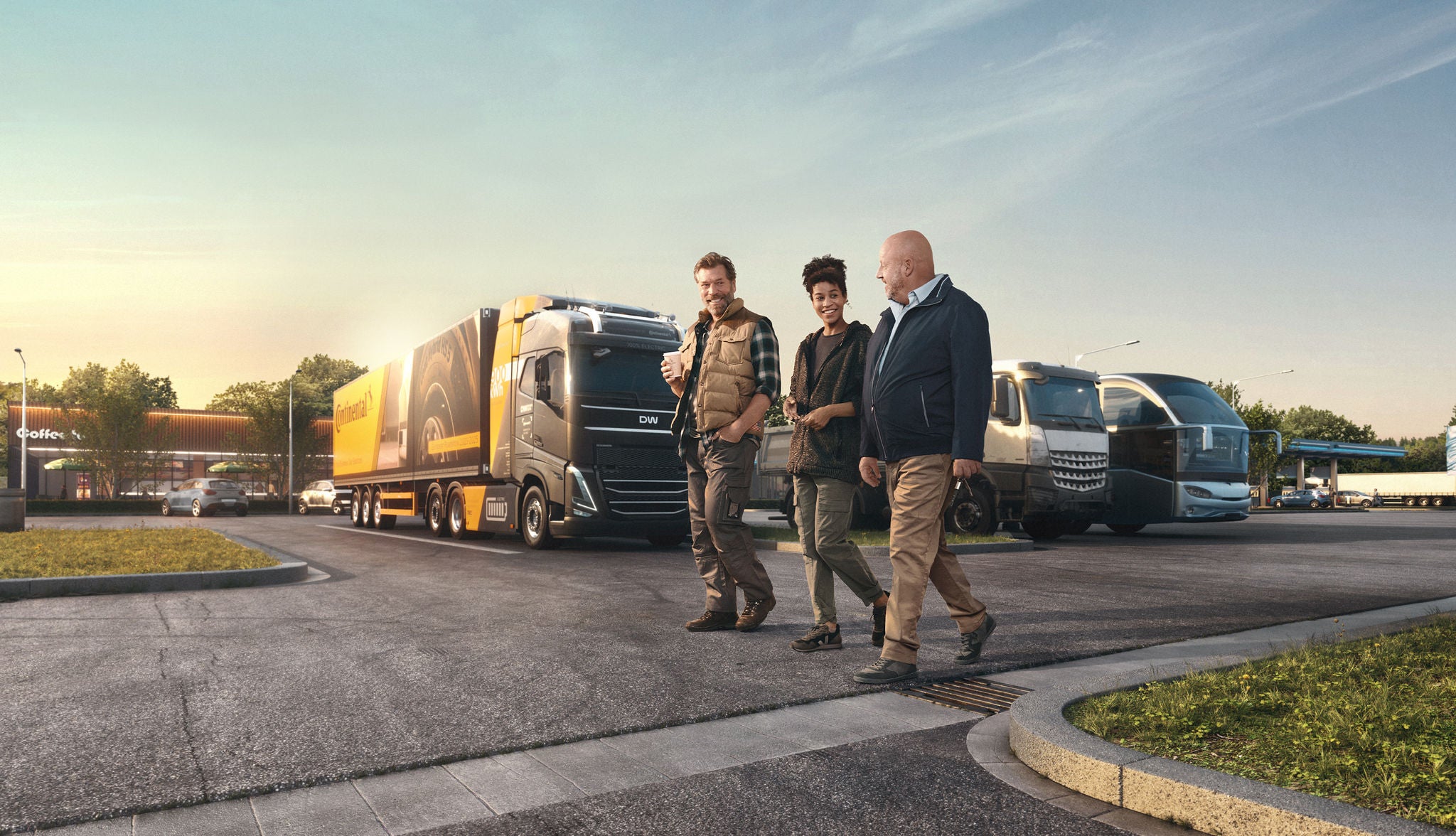 three people walking infront of Trucks