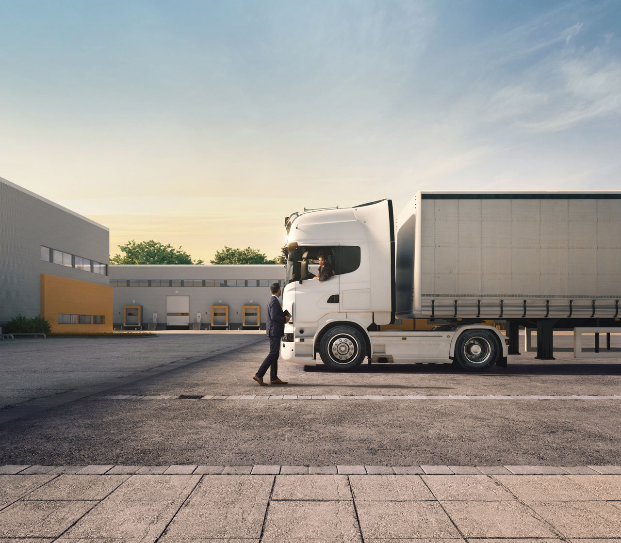 A truck equipped with Continental Hybrid Gen5 tires parks at a logistics center