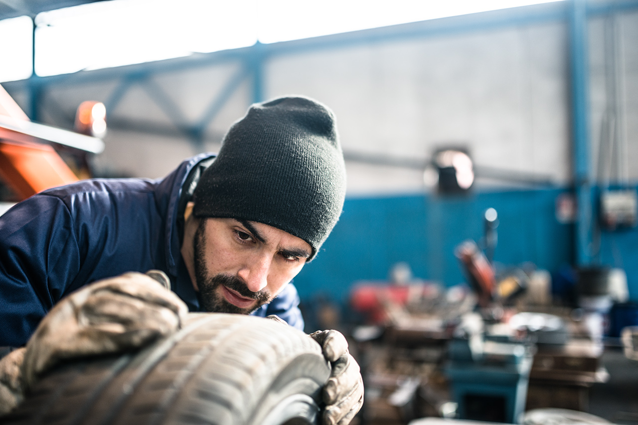 Tire repairer checking the tire integrity