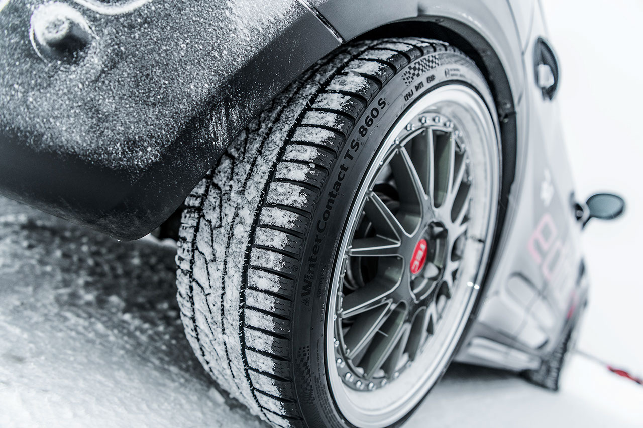 Winter tuning event tire view Front view of Winter Contact TS 860S on a black car.
