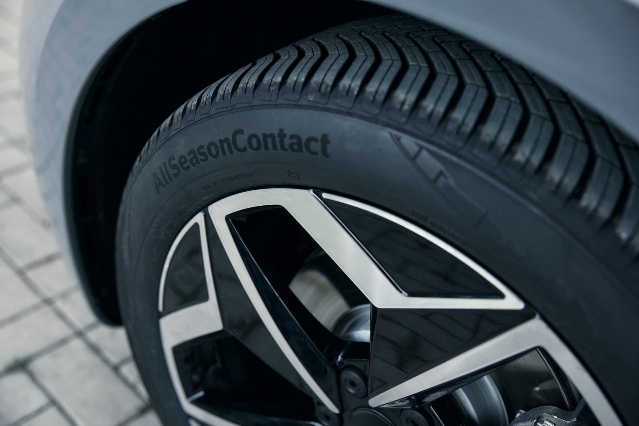 Details of the tread of an all-season Continental tire with branding visible