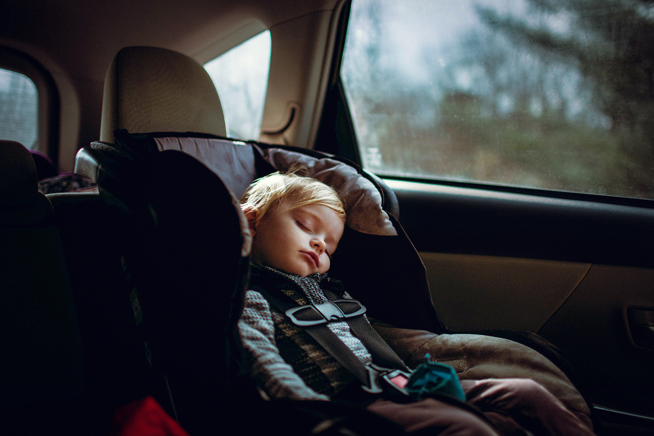 Child sleeping in a car