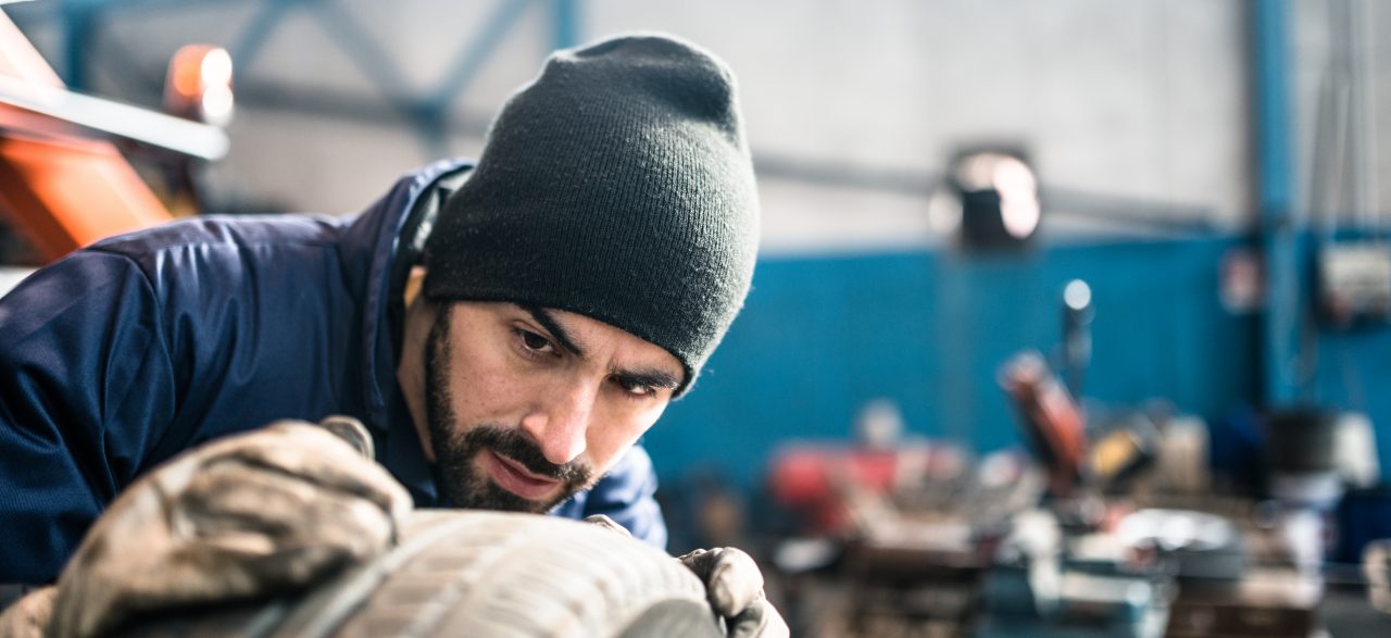 Tire repairer checking the tire integrity