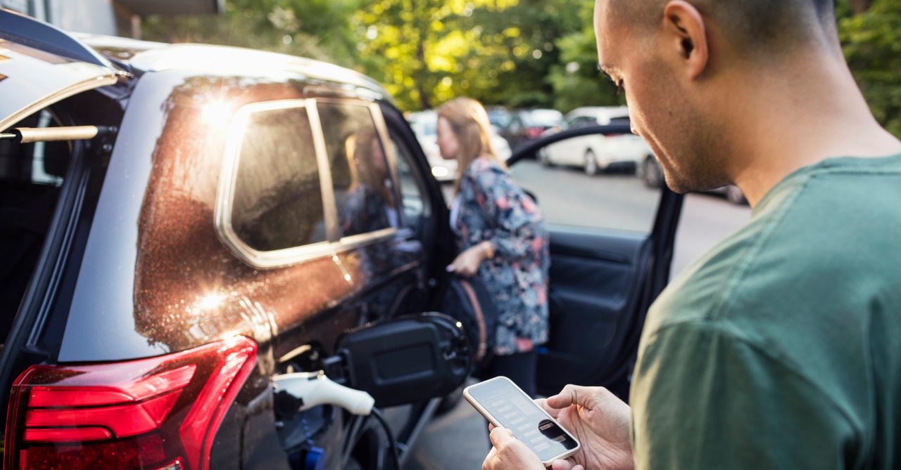 Loading an electric car with smartphone app.