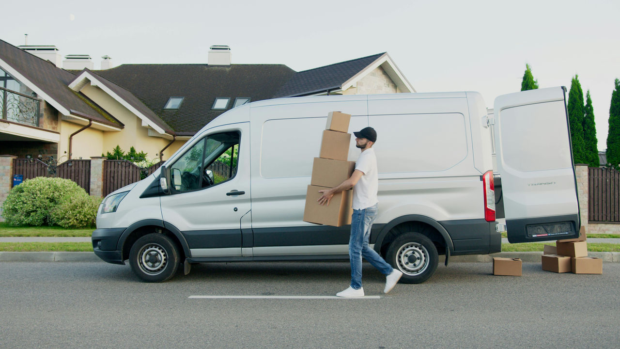 Man unloading boxes from a van