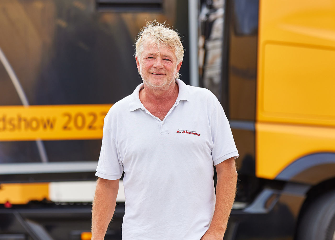 Klaus Altmann standing infront of truck 