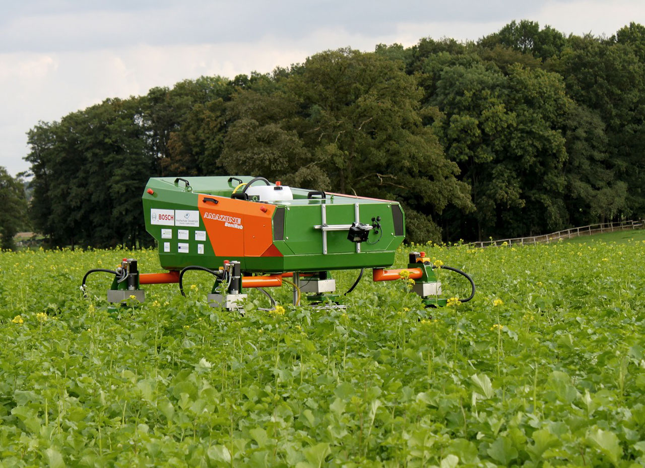 Robot farmer woriking on field