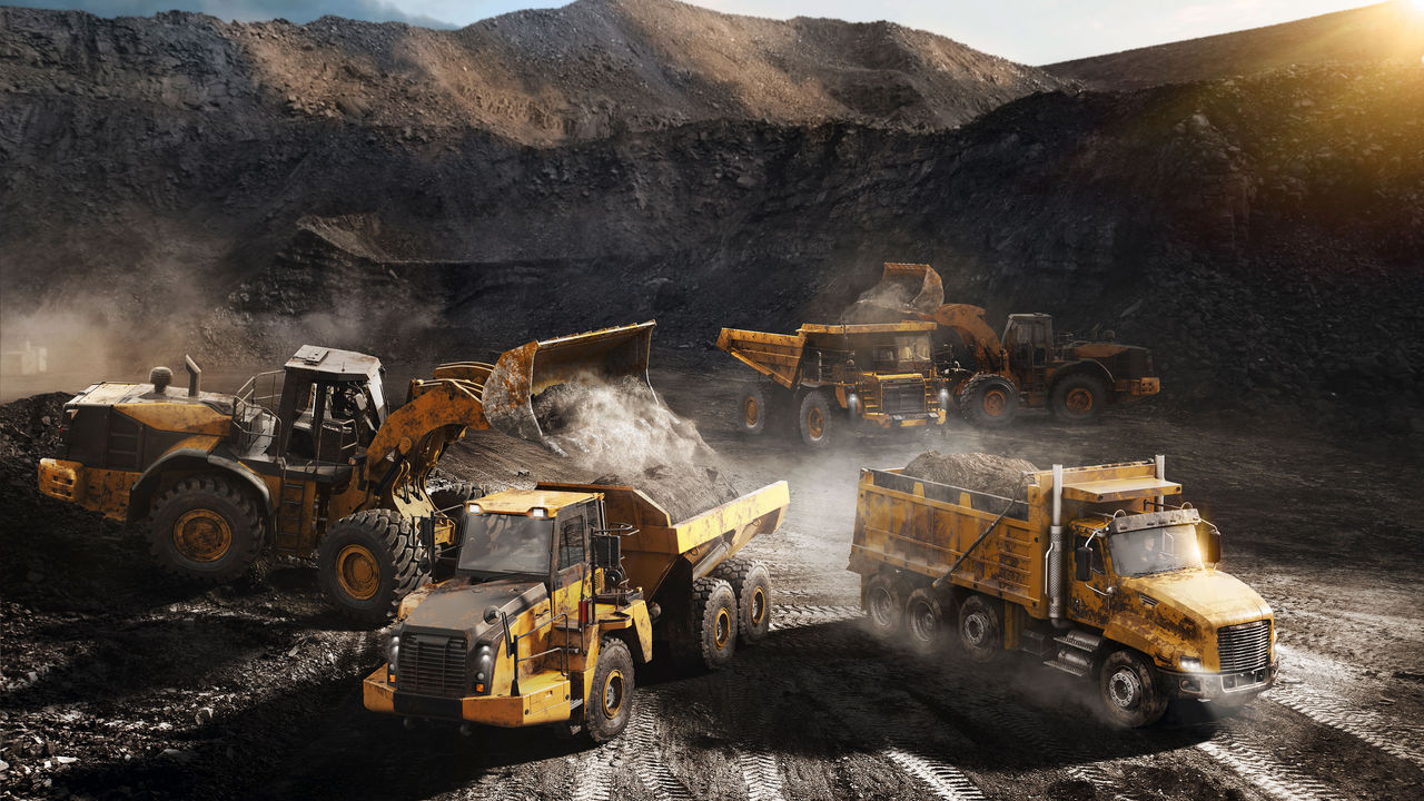 Sideview on a construction side with different vehicles.