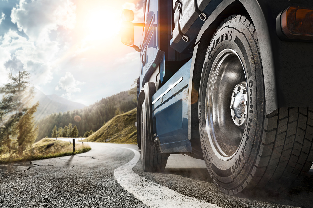 Premium Tires Truck drives on a country road